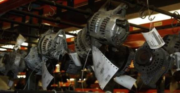 Automotive alternators hanging in a workshop or warehouse